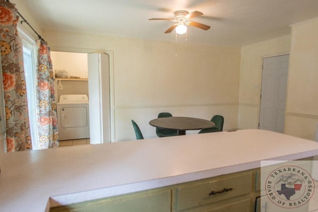 dining room featuring light tile patterned floors, ceiling fan, and washer / dryer