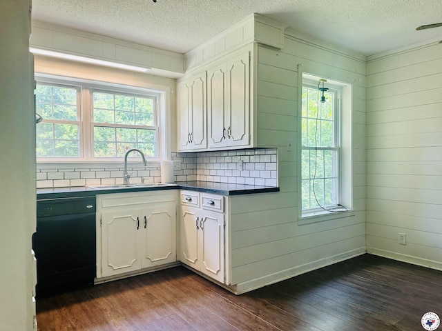 5 Arnold Dr, Texarkana, AR 71854 - kitchen with plenty of natural light, a textured ceiling, dark wood finished floors, black dishwasher, and wooden walls
