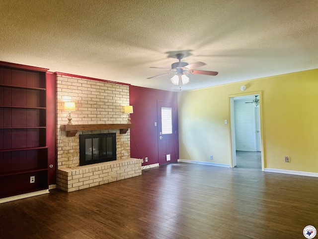 5 Arnold Dr, Texarkana, AR 71854 - unfurnished living room with a textured ceiling, a ceiling fan, wood finished floors, and a fireplace