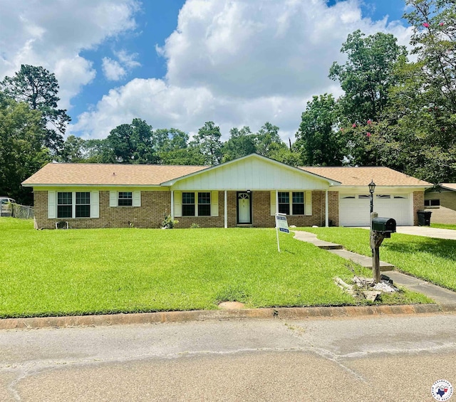 5 Arnold Dr, Texarkana, AR 71854 - single story home with brick siding, a garage, a front yard, and concrete driveway