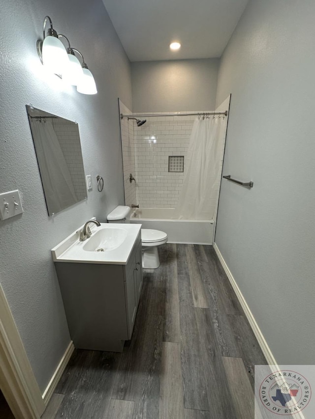 full bathroom with wood-type flooring, toilet, vanity, and shower / bath combo