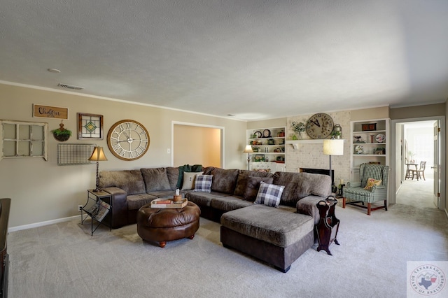 living room featuring a fireplace, built in features, light colored carpet, and a textured ceiling