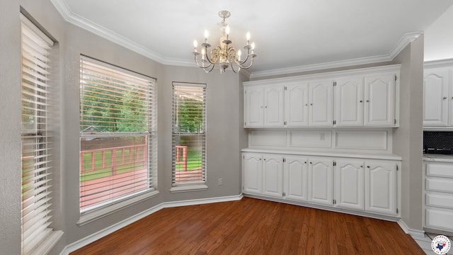 2 Spring Valley Ln, Texarkana, AR 71854 - unfurnished dining area featuring a chandelier, dark wood-style floors, crown molding, and baseboards