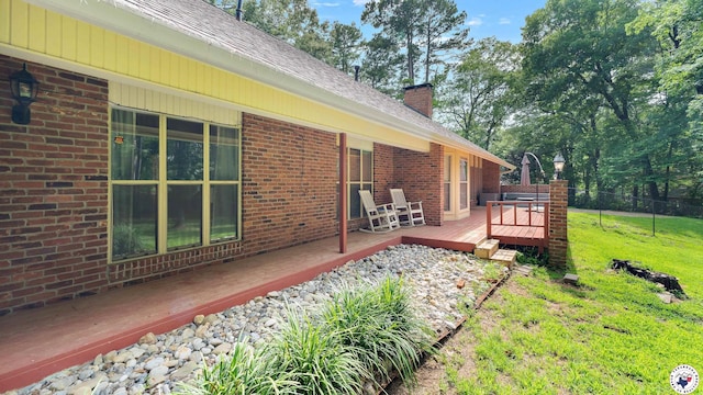 2 Spring Valley Ln, Texarkana, AR 71854 - view of property exterior with a wooden deck, a chimney, and brick siding