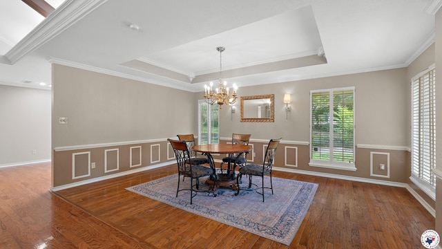 2 Spring Valley Ln, Texarkana, AR 71854 - dining room with wood finished floors, ornamental molding, a chandelier, a raised ceiling, and baseboards