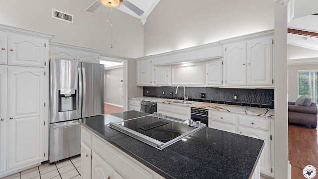 2 Spring Valley Ln, Texarkana, AR 71854 - kitchen with black appliances, a sink, white cabinets, high vaulted ceiling, and a ceiling fan