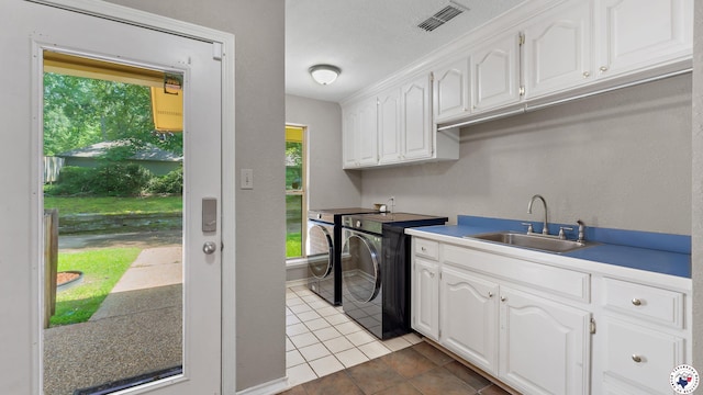 2 Spring Valley Ln, Texarkana, AR 71854 - washroom featuring washing machine and clothes dryer, cabinet space, and light tile patterned flooring