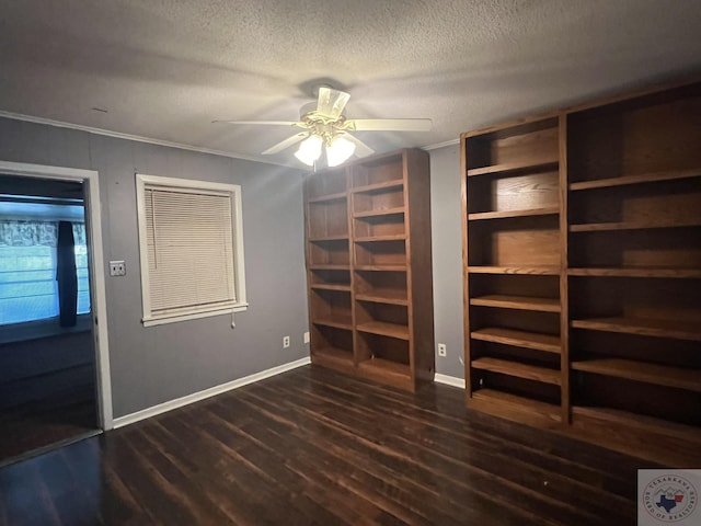 30 Broadmoor Dr, Texarkana, AR 71854 - unfurnished bedroom featuring dark wood-style flooring, a textured ceiling, baseboards, and crown molding