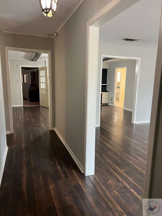 30 Broadmoor Dr, Texarkana, AR 71854 - hallway with baseboards, dark wood finished floors, and a textured ceiling