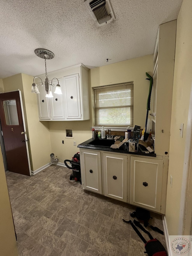 30 Broadmoor Dr, Texarkana, AR 71854 - washroom featuring hookup for a washing machine, electric dryer hookup, a textured ceiling, and baseboards