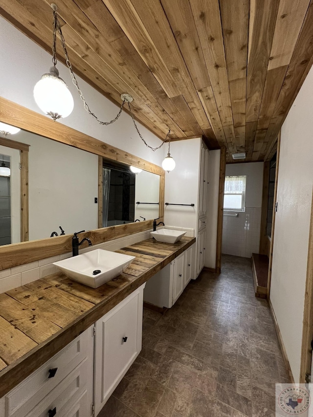 30 Broadmoor Dr, Texarkana, AR 71854 - full bathroom with double vanity, wooden ceiling, and stone finish flooring