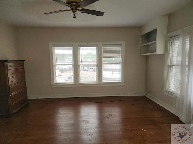 unfurnished room featuring ceiling fan and dark hardwood / wood-style floors