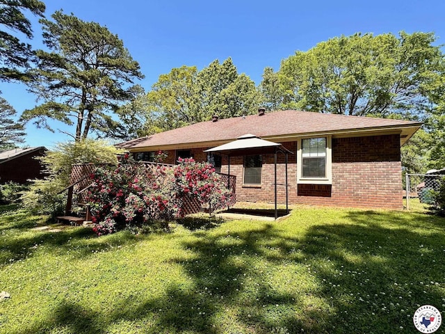 3119CLEARCREE Clear Crk, Texarkana, TX 75503 - back of house with brick siding and a yard
