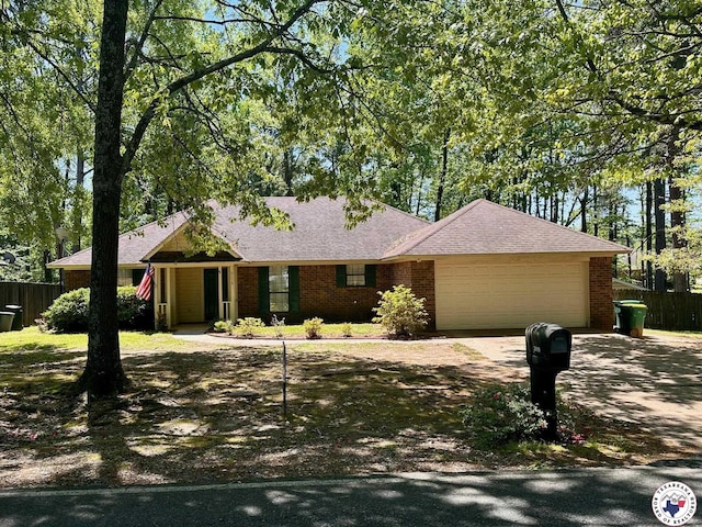 3119CLEARCREE Clear Crk, Texarkana, TX 75503 - ranch-style house featuring a garage, driveway, brick siding, and roof with shingles