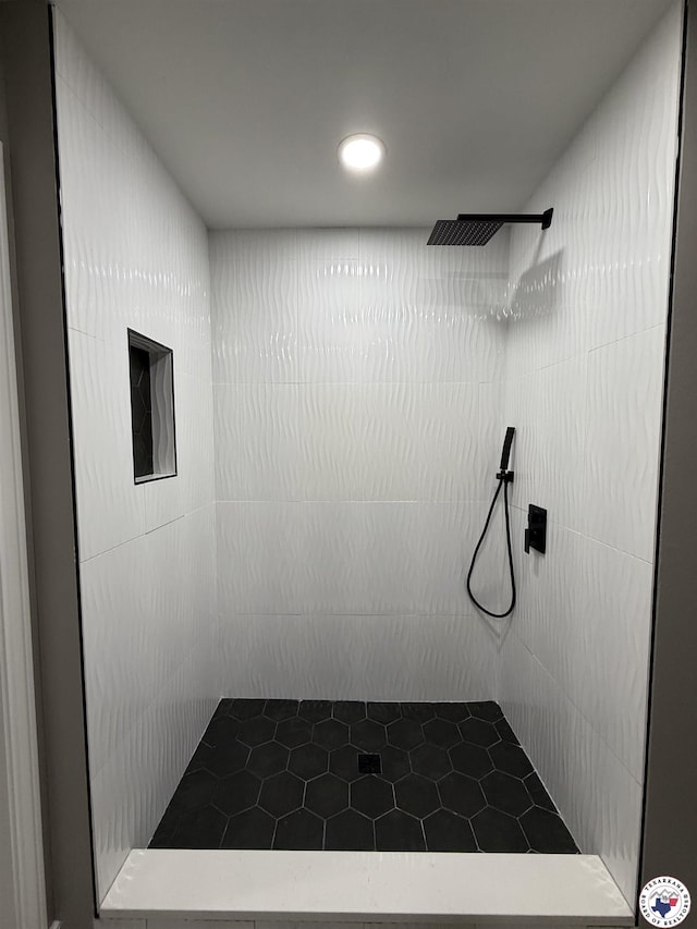 full bathroom with recessed lighting, tiled shower, and tile patterned floors