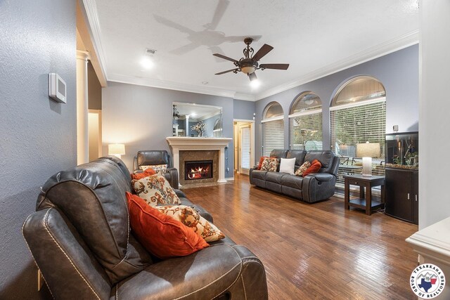 6404 N Park Rd, Texarkana, TX 75503 - living area with a ceiling fan, a fireplace with flush hearth, ornamental molding, and wood finished floors