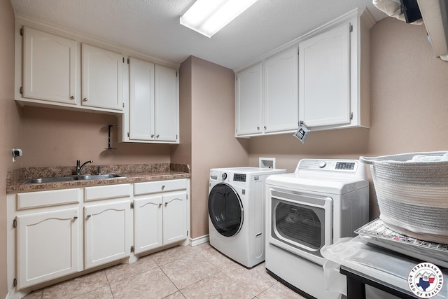 6404 N Park Rd, Texarkana, TX 75503 - laundry room with cabinet space, light tile patterned flooring, washing machine and dryer, and a sink