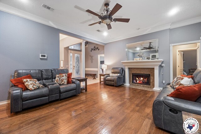 6404 N Park Rd, Texarkana, TX 75503 - living area featuring visible vents, a fireplace with flush hearth, ceiling fan, and wood finished floors