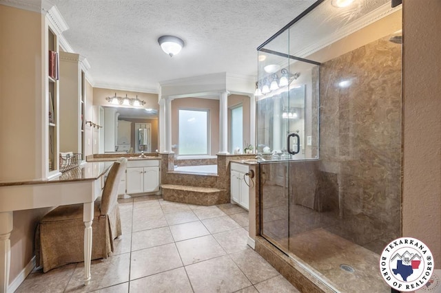 6404 N Park Rd, Texarkana, TX 75503 - bathroom with decorative columns, a bath, crown molding, tile patterned flooring, and a stall shower