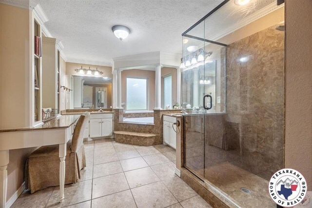 6404 N Park Rd, Texarkana, TX 75503 - bathroom with decorative columns, a bath, crown molding, tile patterned flooring, and a stall shower