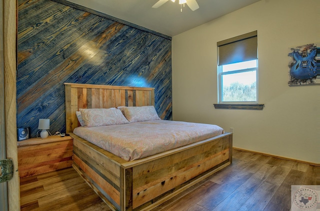 bedroom featuring ceiling fan and dark hardwood / wood-style flooring