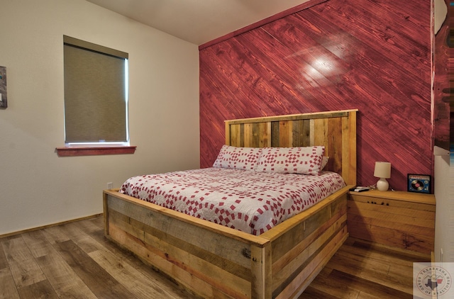 bedroom with hardwood / wood-style floors