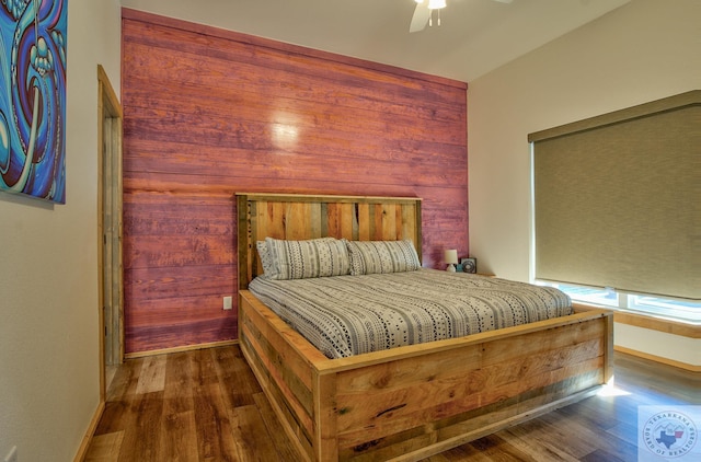 bedroom with ceiling fan and dark hardwood / wood-style flooring