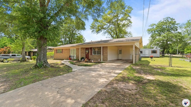 4133 Minden Ave, Texarkana, AR 71854 - view of front of home with brick siding, driveway, a carport, and a gate