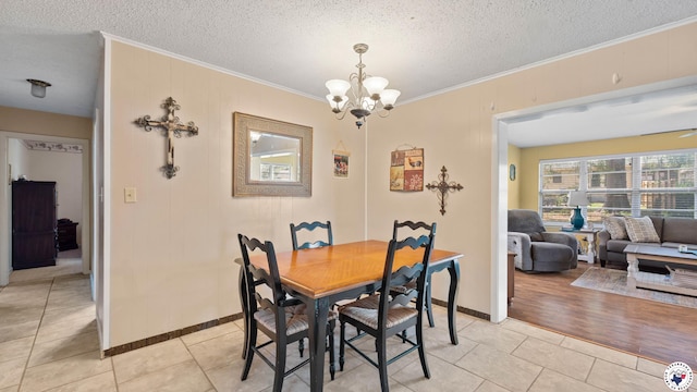 4133 Minden Ave, Texarkana, AR 71854 - dining area featuring crown molding, a chandelier, light tile patterned flooring, baseboards, and a textured ceiling