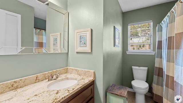 4133 Minden Ave, Texarkana, AR 71854 - bathroom with toilet, vanity, and curtained shower