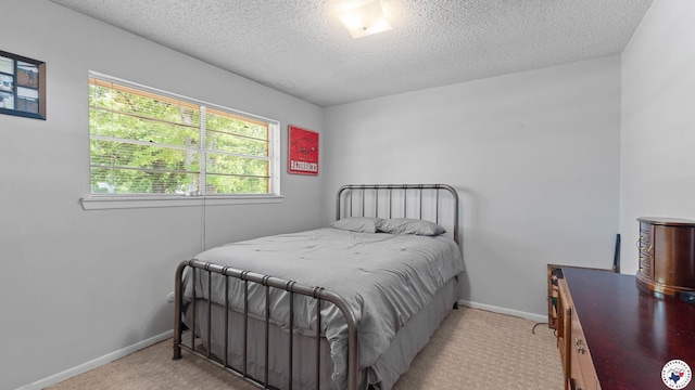 4133 Minden Ave, Texarkana, AR 71854 - bedroom featuring a textured ceiling, carpet floors, and baseboards
