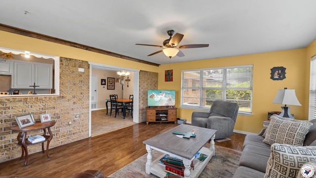 4133 Minden Ave, Texarkana, AR 71854 - living area featuring wood finished floors, ceiling fan, a chandelier, and baseboards