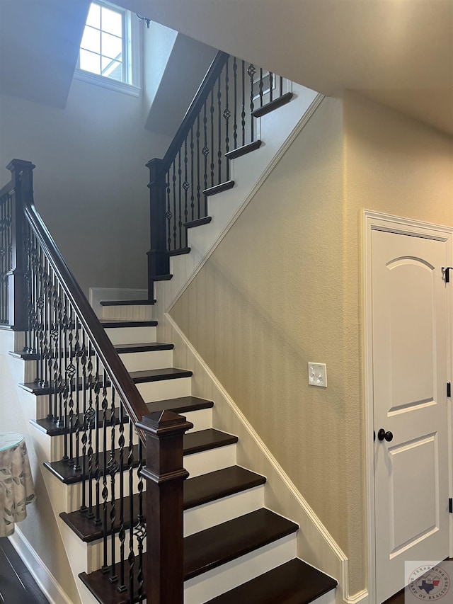 stairway featuring hardwood / wood-style floors