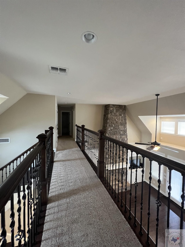 hallway with vaulted ceiling