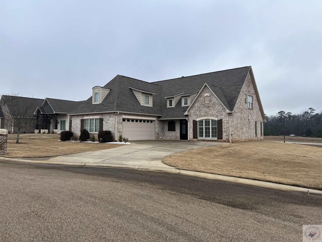 french country style house with a front lawn