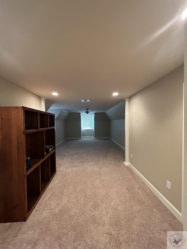 bonus room with carpet floors and vaulted ceiling