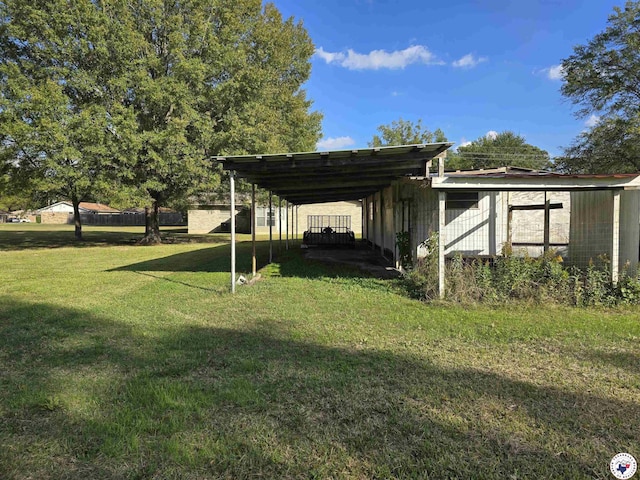 123 Texas Ln, New Boston, TX 75570 - view of grassy yard featuring a carport