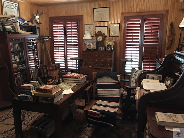 office area featuring wood walls and a healthy amount of sunlight