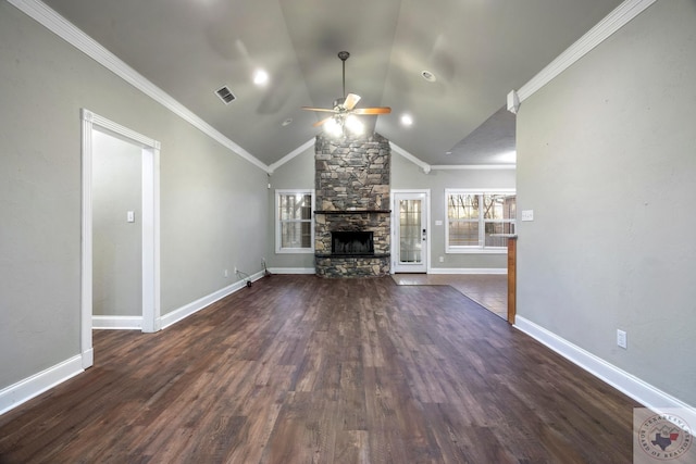 unfurnished living room with lofted ceiling, dark wood-type flooring, a fireplace, ceiling fan, and crown molding