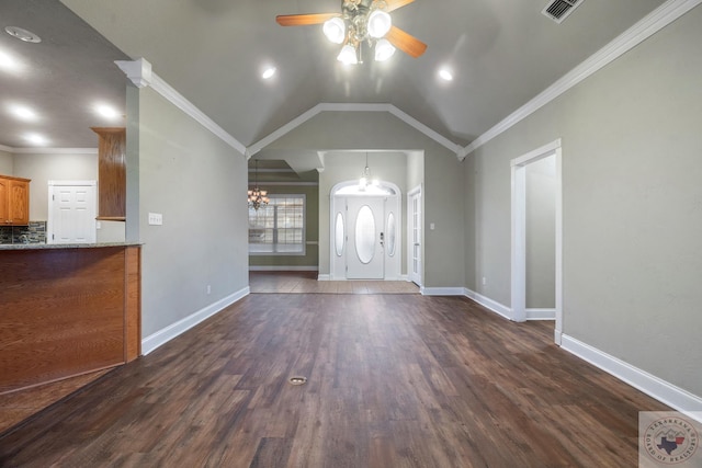 entryway with lofted ceiling, dark hardwood / wood-style floors, and crown molding