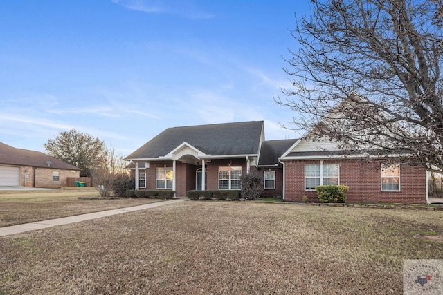 ranch-style house with a front yard