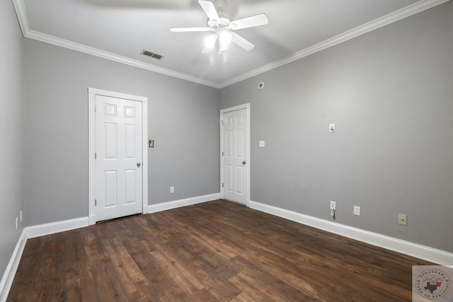 empty room featuring ceiling fan, ornamental molding, and dark hardwood / wood-style floors