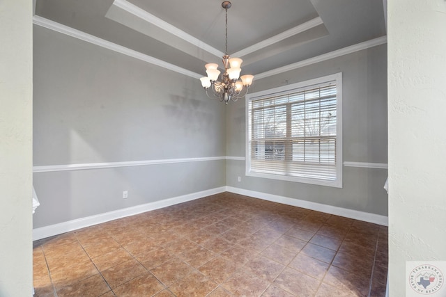 spare room with crown molding, a raised ceiling, a chandelier, and tile patterned flooring