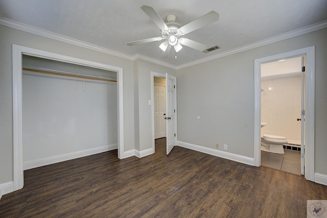 unfurnished bedroom with a closet, visible vents, ornamental molding, wood finished floors, and baseboards