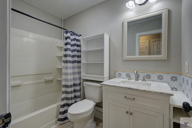 bathroom featuring shower / bath combination with curtain, toilet, a textured ceiling, vanity, and tile patterned floors