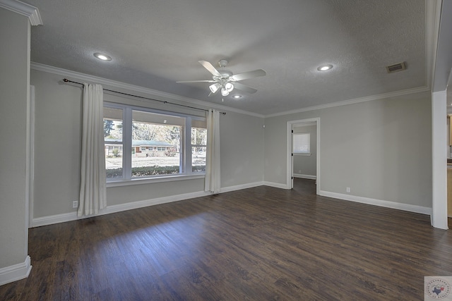 unfurnished room with a textured ceiling, dark wood finished floors, visible vents, and crown molding