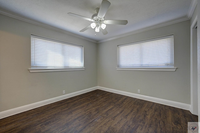 spare room featuring a textured ceiling, dark wood-type flooring, a ceiling fan, baseboards, and ornamental molding