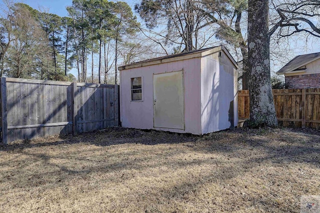 view of shed with a fenced backyard