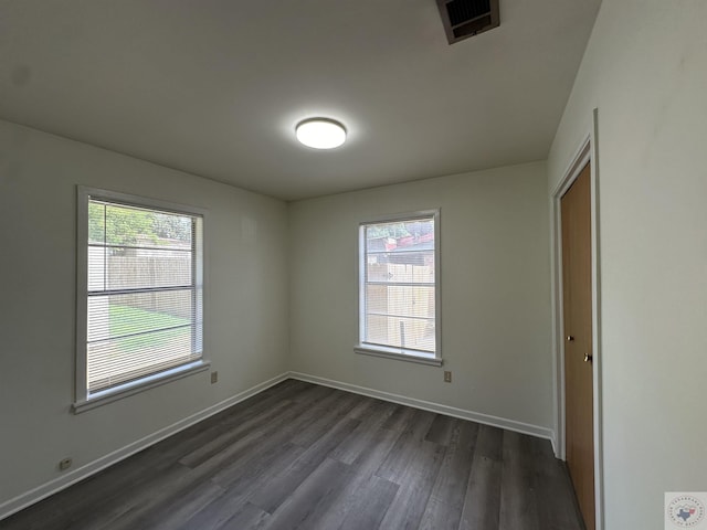 unfurnished bedroom featuring dark wood-type flooring