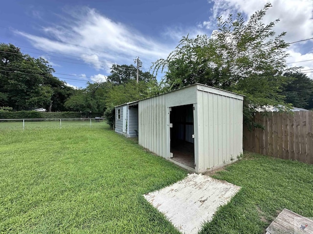 view of outdoor structure featuring a yard